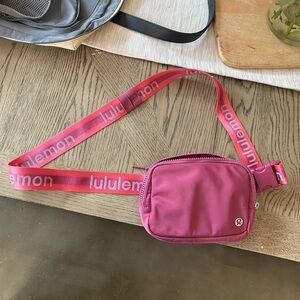 Lululemon Everywhere Belt Bag in dark pink/fuchsia color